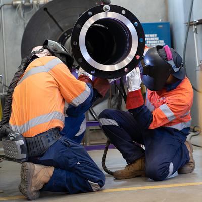 Decorative image - two people working in workshop welding (NMTAFE)