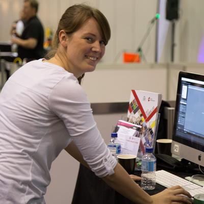 NMATFE staff member at the Skills West Expo 2019 looking at camera and smiling (NMATFE)