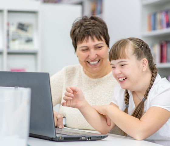 Decorative image - helping a student with needs