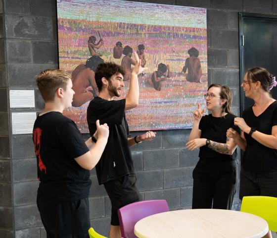 A group of people using Auslan