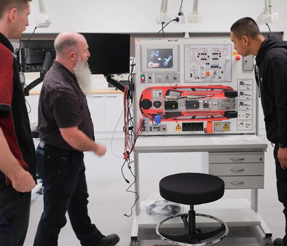 Decorative image - students learning in the new EV automotive workshop