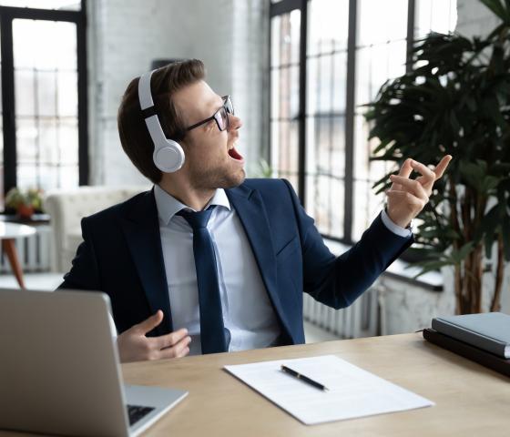 Decorative image - Man singing music at the desk