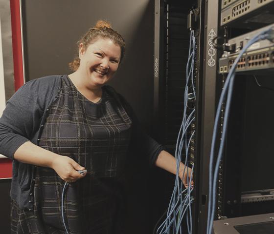Decorative image - a person working in a server room