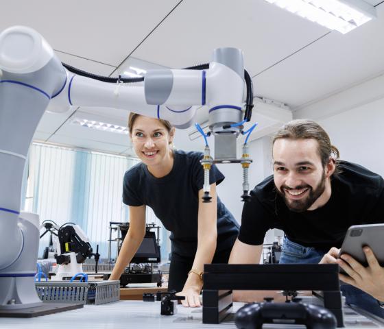 Decorative image - Students using robotic arm - Istock