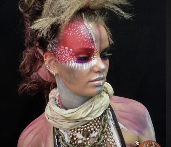 Student applied hair, face and body makeup applied to model